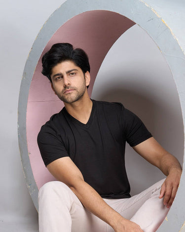 Bamboo V-Neck T-Shirt in black worn by male model, showcasing soft, breathable fabric ideal for sustainable everyday wear.