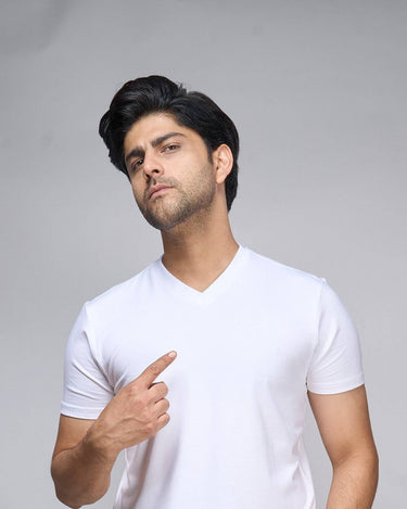 Male model wearing Bamboo V-Neck T-Shirt in white, showcasing its soft, breathable fabric and clean-cut fit for sustainable everyday wear.